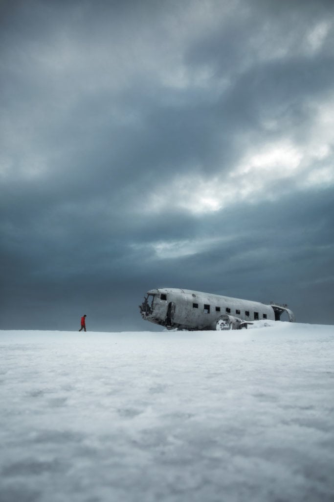 An abandoned wreck of an airplane on the snow