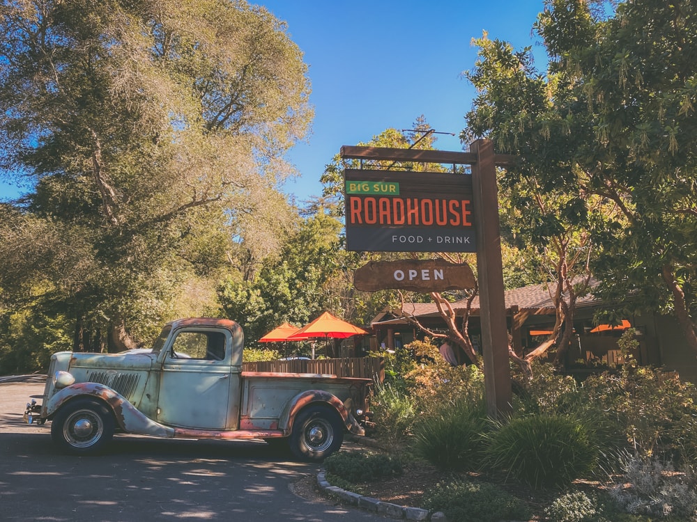 An old grey pickup truck sits outside the Big Sur Roadhouse restaurant as a decoration for passing motorists to see.