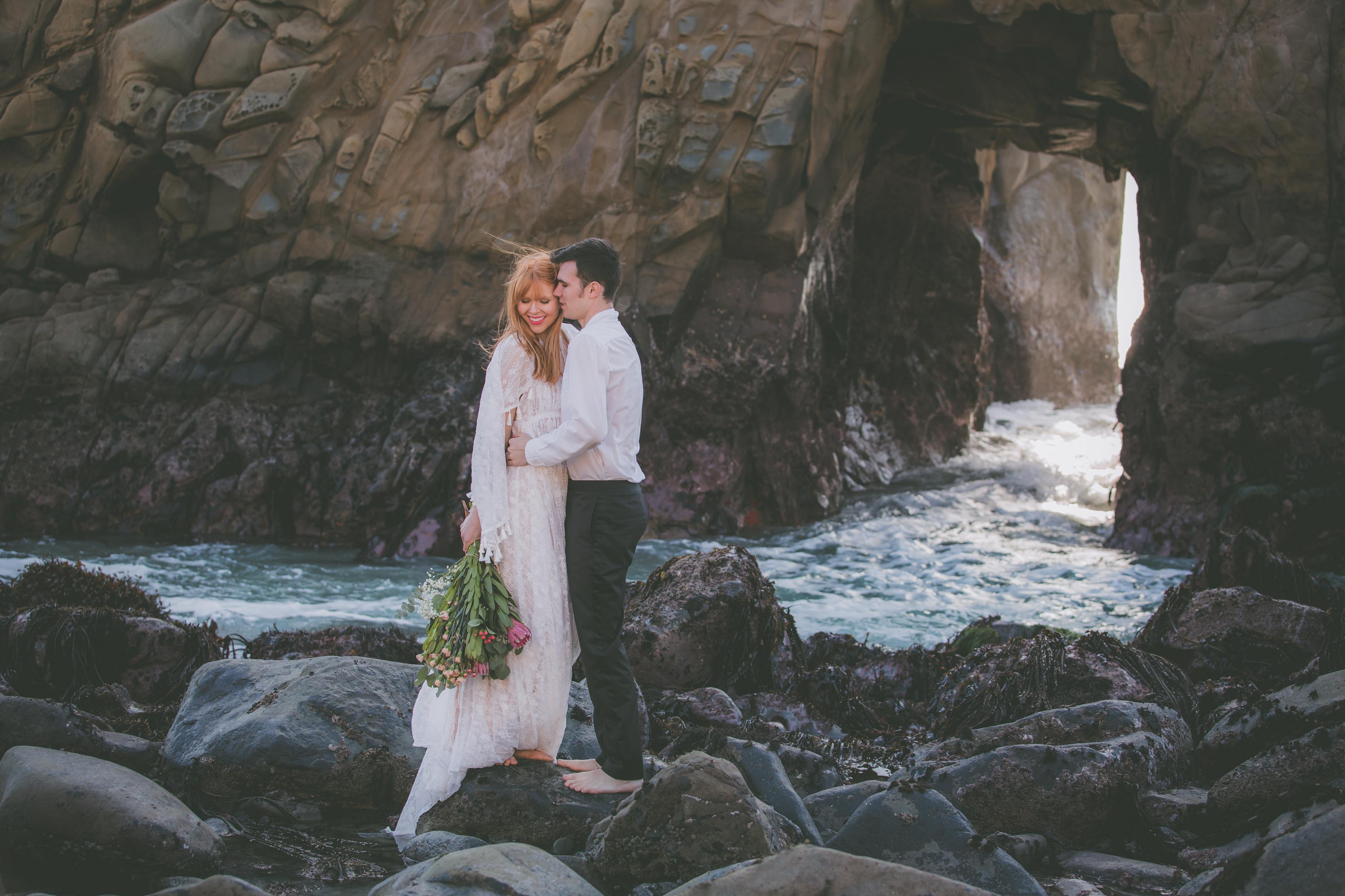 A couple has an elopement at a beach in Big Sur.